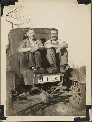 Claude Hurelle with hired hand Oren in his Model T Ford in 1930
