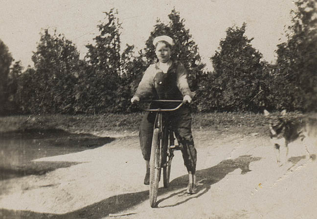 Willard rides his bike around the farm.