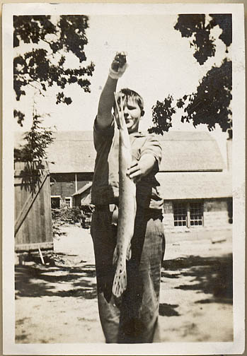 Willard catches a pike fishing in 1930