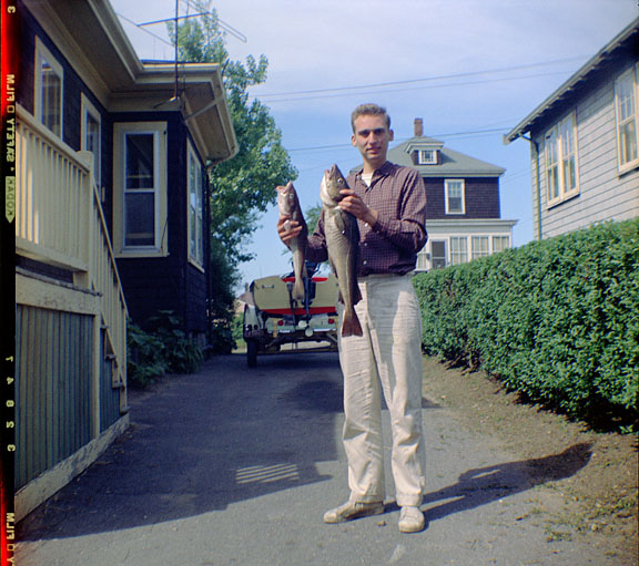 1960s Bob holding freshly caught cod fish
