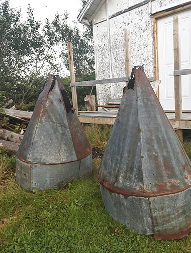 Old early 1900s cod liver oil vats or funnels