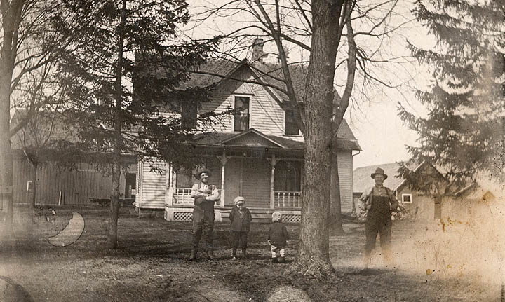 Elmer with Claude and Walter in front of the Otsego farm house.