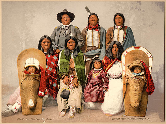 Ute chief Severo and his family pose together in a studio in the late 1800's. Hand tinted color was added to the black and white photo taken by William Henry Jackson where Chief Severo stands tall in a military uniform. Parsons Collection 